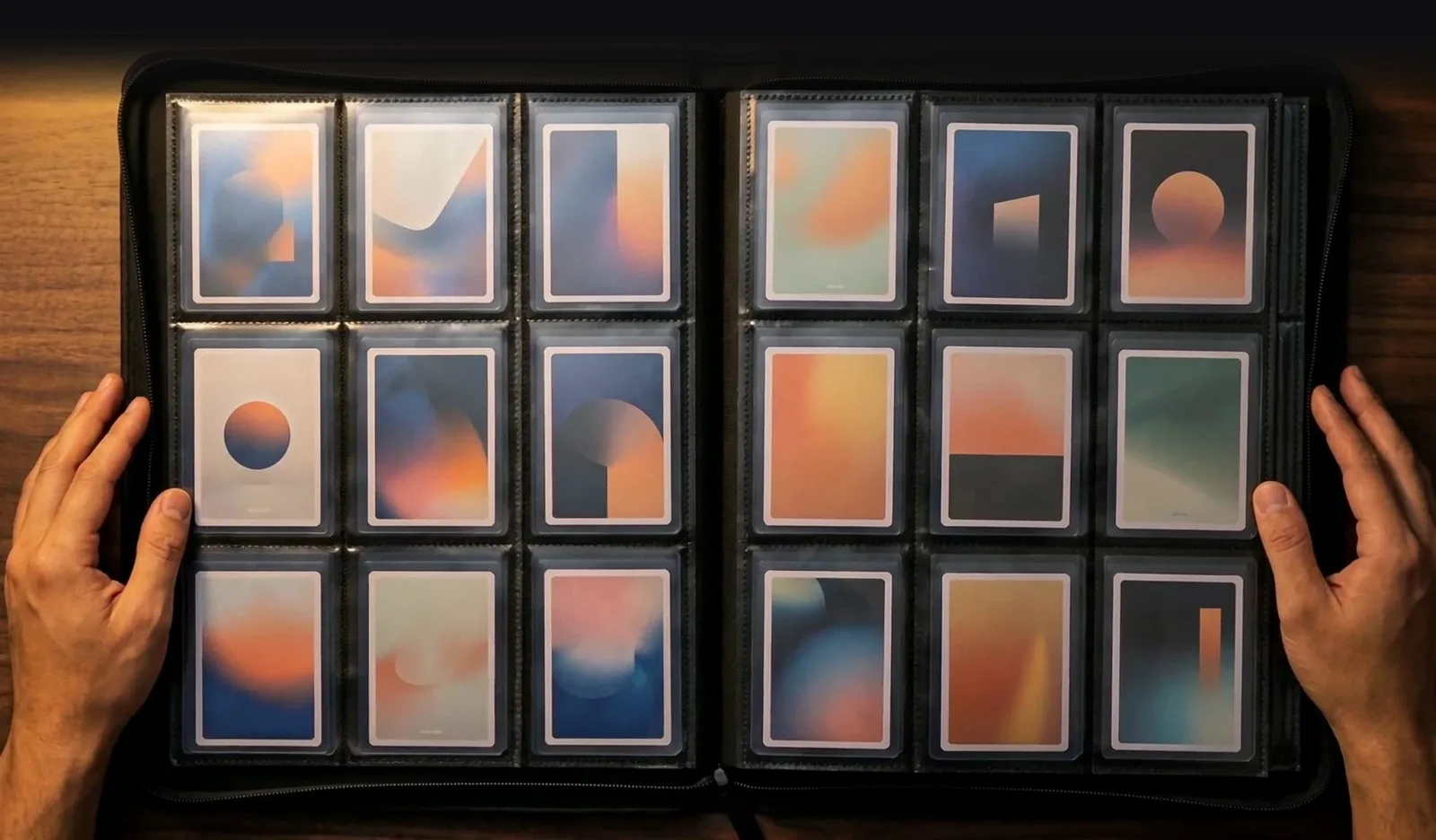 An open InfinityVault 216-card binder, nine pockets per side, toploaders seated flat back to back.